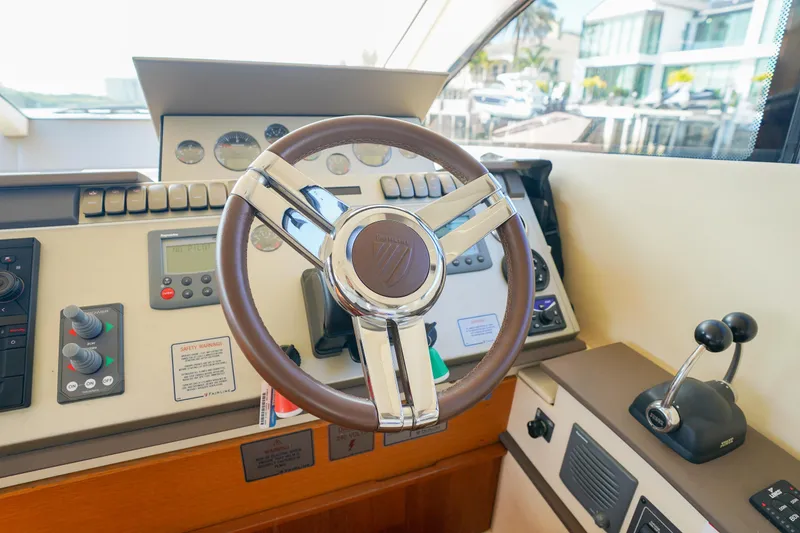 Slide: The Image of Steering wheel and controls of 2009 Fairline 48 Phantom yacht cockpit. - 18