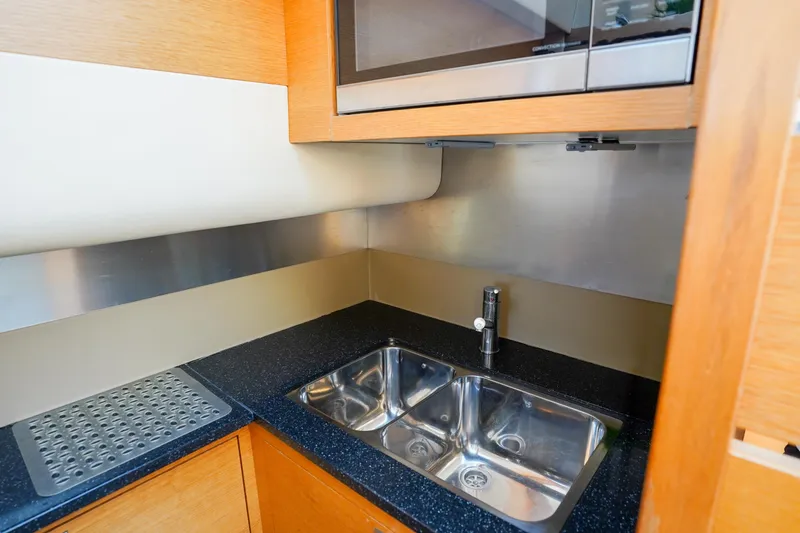 Slide: The Image of Modern kitchen area in 2009 Fairline 48 Phantom yacht with stainless steel sink. - 26