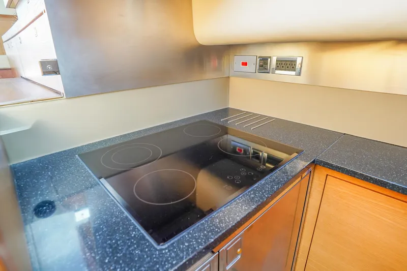 Slide: The Image of Modern kitchen in 2009 Fairline 48 Phantom yacht with sleek induction cooktop. - 27