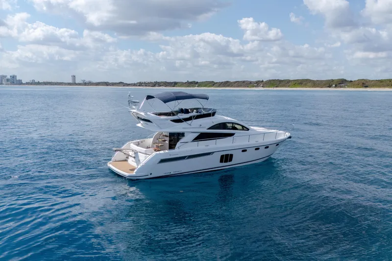 Slide: The Image of Luxury 2009 Fairline 48 Phantom yacht cruising on open blue sea. - 4