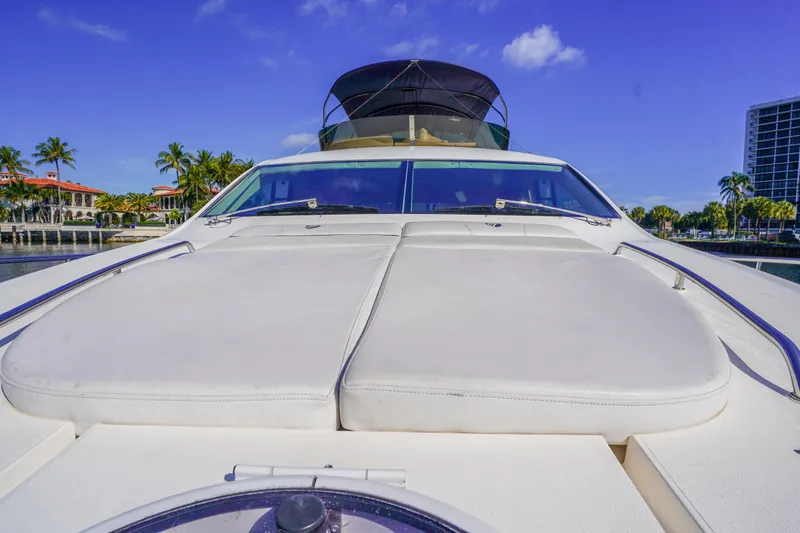 Slide: The Image of 2009 Fairline 48 Phantom yacht with sun deck, palm trees, and blue sky background. - 42