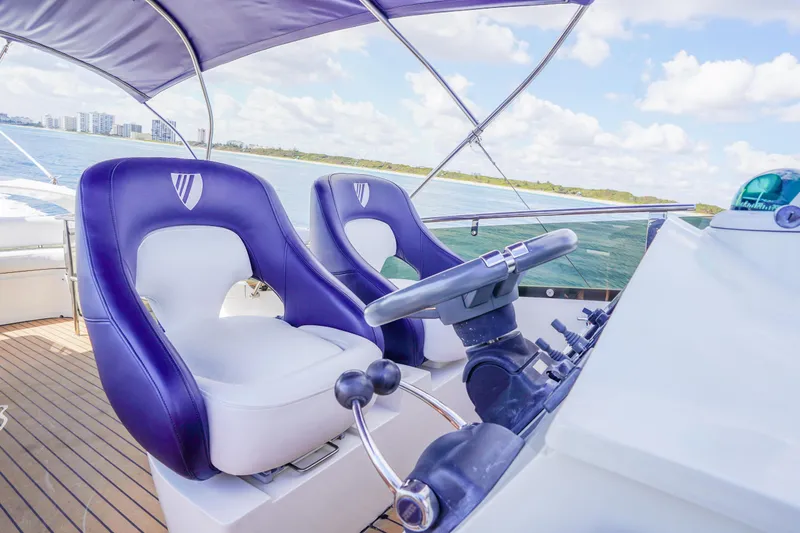 Slide: The Image of Luxury helm of 2009 Fairline 48 Phantom yacht with plush seating and ocean view. - 49