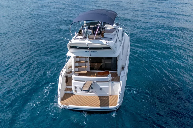 Slide: The Image of 2009 Fairline 48 Phantom yacht cruising on open blue water. - 5