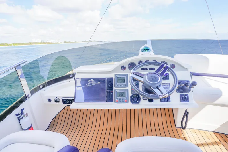 Slide: The Image of Helm of 2009 Fairline 48 Phantom yacht with modern navigation equipment and ocean view. - 51
