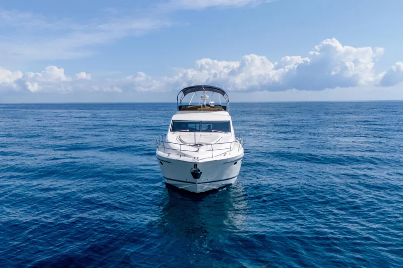Slide: The Image of 2009 Fairline 48 Phantom yacht on open sea under blue sky. - 6