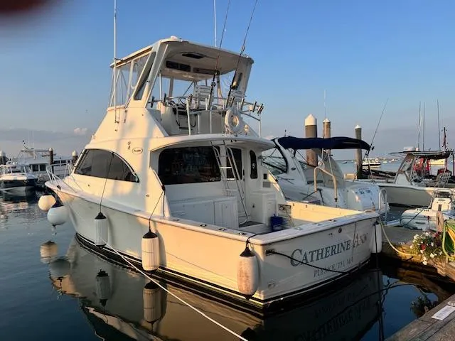 Slide: The Image of 1998 Ocean Yachts 40 Super Sport docked at marina, rear view. - 1