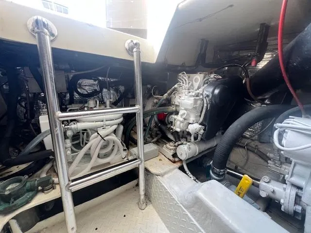 Slide: The Image of Engine compartment of a 1998 Ocean Yachts 40 Super Sport boat, showing mechanical components. - 27
