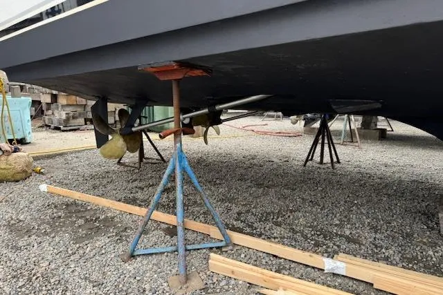 Slide: The Image of 1998 Ocean Yachts 40 Super Sport on stands, showing propellers and hull. - 5