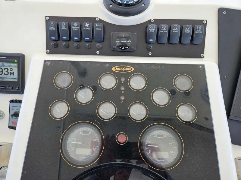 Slide: The Image of Control panel of a 1998 Ocean Yachts 40 Super Sport boat with gauges and switches. - 13
