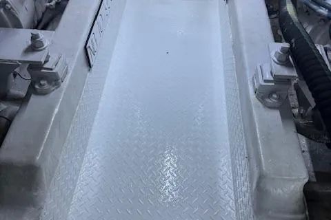 Slide: The Image of Engine room of a 1998 Ocean Yachts 40 Super Sport with metallic flooring. - 22