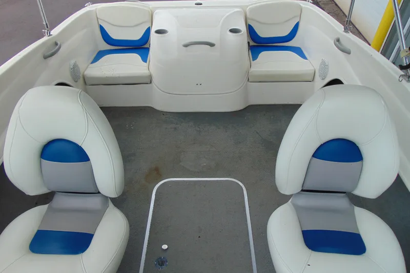 Slide: The Image of 2007 Bayliner 175 Bowrider interior with white and blue seating arrangement. - 10