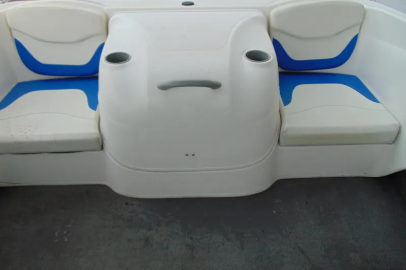 Slide: The Image of 2007 Bayliner 175 Bowrider interior seating with blue and white cushions. - 11