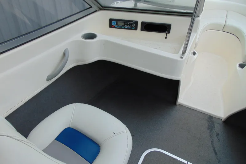Slide: The Image of 2007 Bayliner 175 Bowrider interior with seating, cup holder, and control panel. - 12