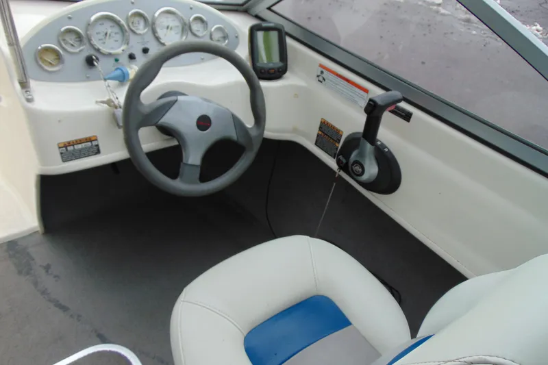Slide: The Image of 2007 Bayliner 175 Bowrider dashboard with steering wheel and control panel. - 13