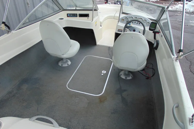Slide: The Image of 2007 Bayliner 175 Bowrider interior with two swivel seats and dashboard view. - 9