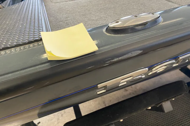 Slide: The Image of 2023 Ranger RT188 boat detail with yellow sticky note on deck. - 11