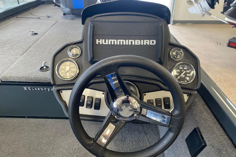 Slide: The Image of 2023 Ranger RT188 boat dashboard with Humminbird display and steering wheel. - 3