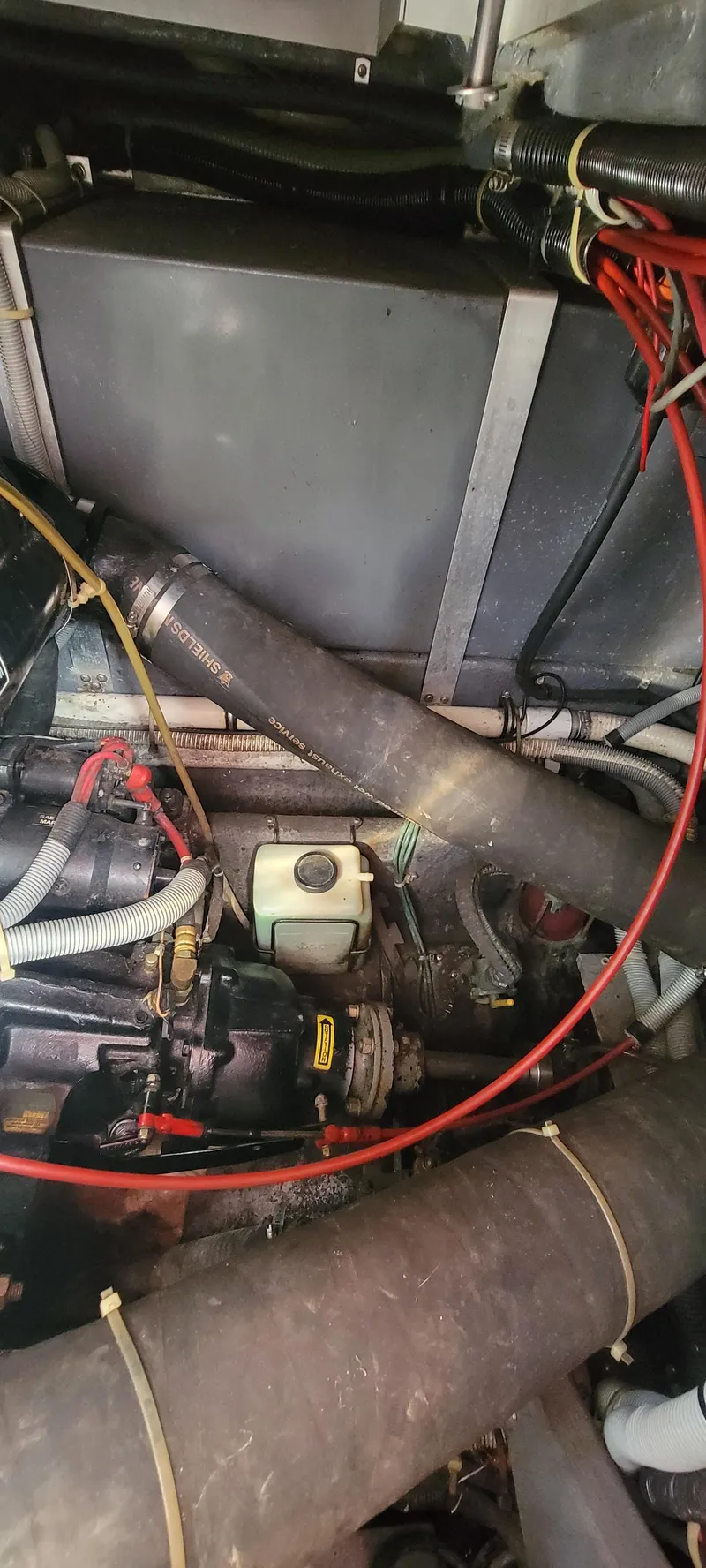 Slide: The Image of Engine compartment of a 1988 Sea Ray 340 Express Cruiser boat. - 13