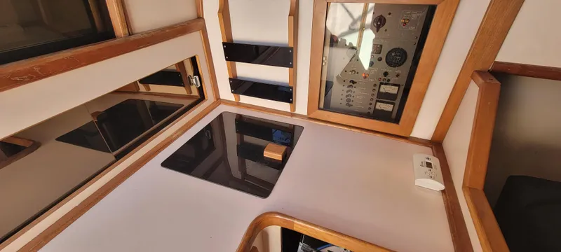 Slide: The Image of Interior of 1988 Sea Ray 340 Express Cruiser with wood paneling. - 21