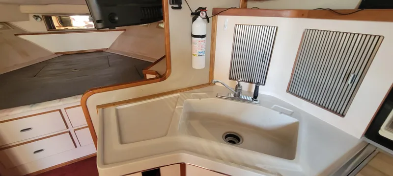 Slide: The Image of Galley area of 1988 Sea Ray 340 Express Cruiser. - 29