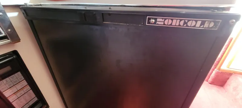 Slide: The Image of Dometic fridge in a 1988 Sea Ray 340 Express Cruiser. - 30