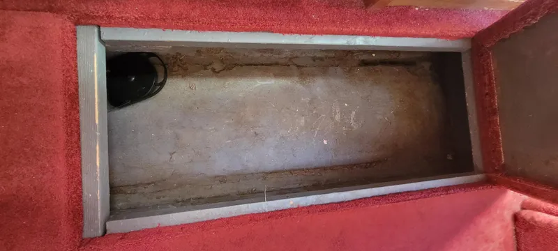 Slide: The Image of Interior of 1988 Sea Ray 340 Express Cruiser with red carpet. - 32