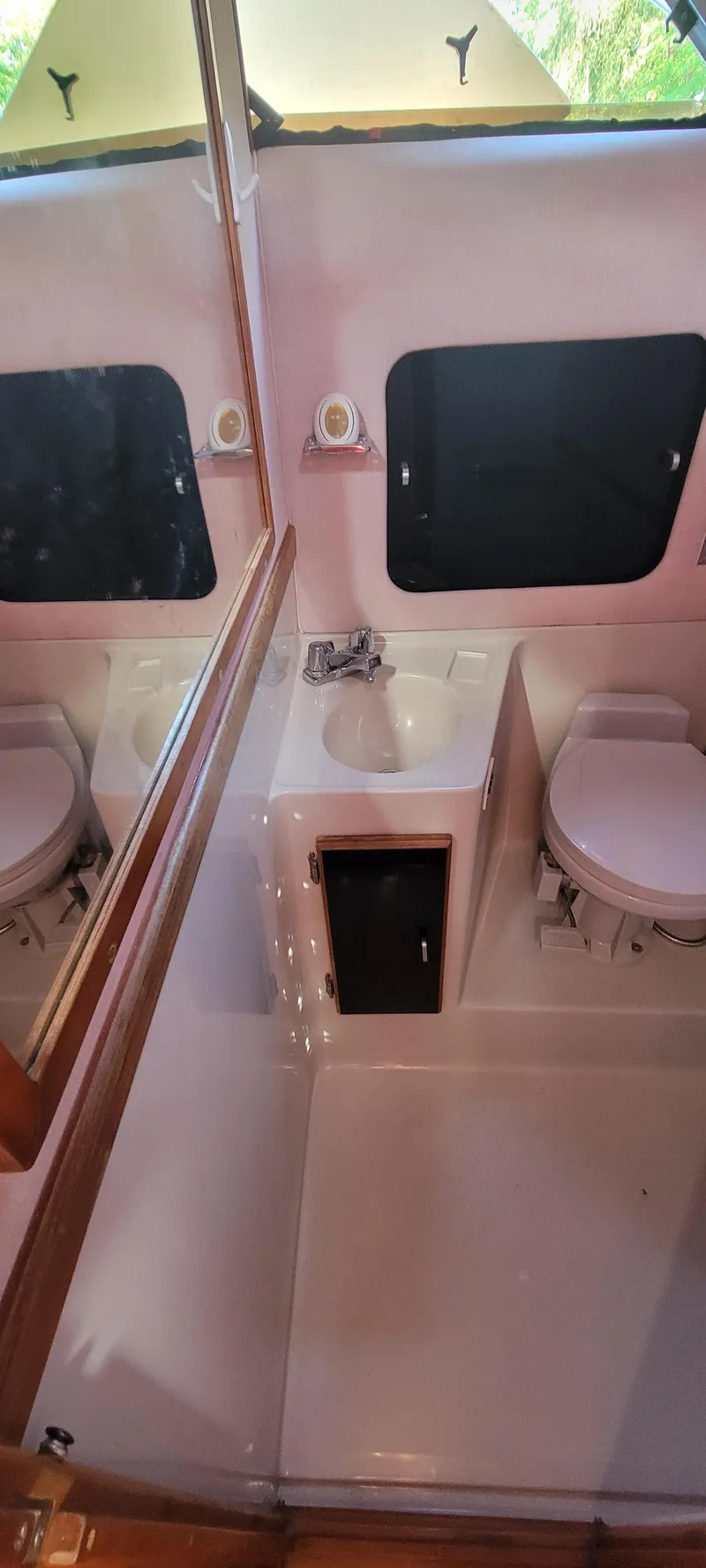 Slide: The Image of Interior of 1988 Sea Ray 340 Express Cruiser, bathroom view. - 35