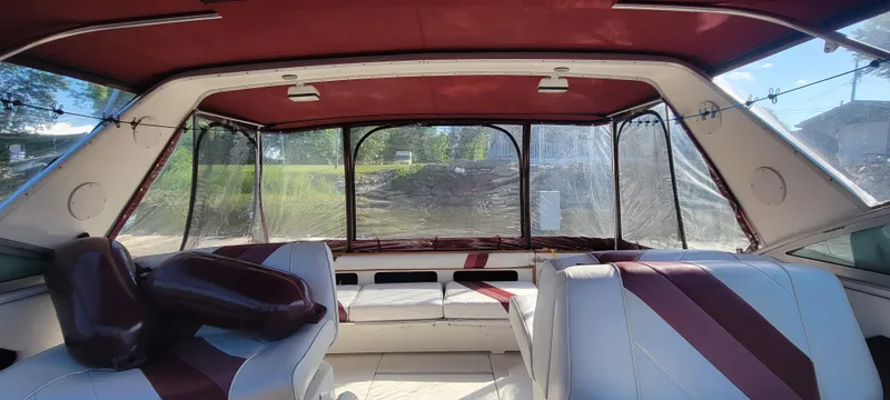 Slide: The Image of Interior of a 1988 Sea Ray 340 Express Cruiser with red accents. - 38