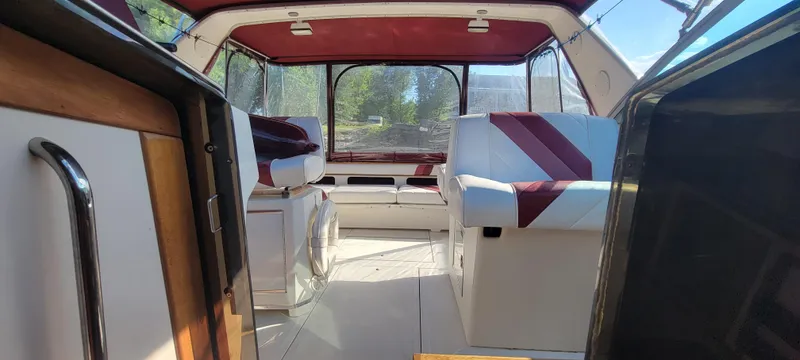 Slide: The Image of Interior of a 1988 Sea Ray 340 Express Cruiser with red accents. - 39