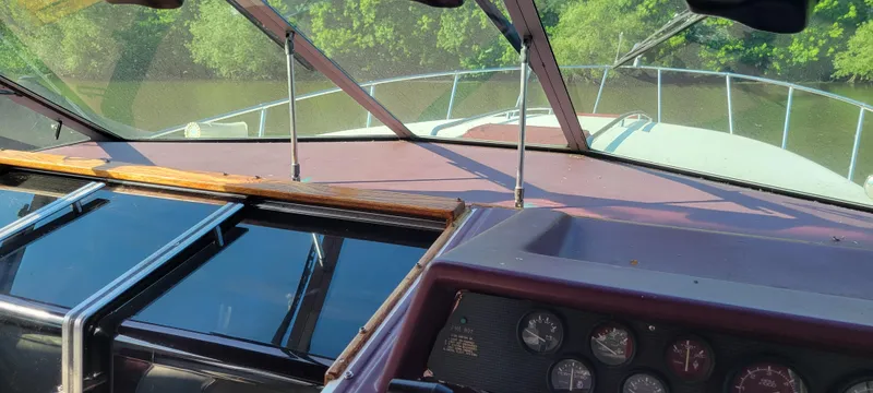 Slide: The Image of Cockpit of 1988 Sea Ray 340 Express Cruiser on calm water. - 42