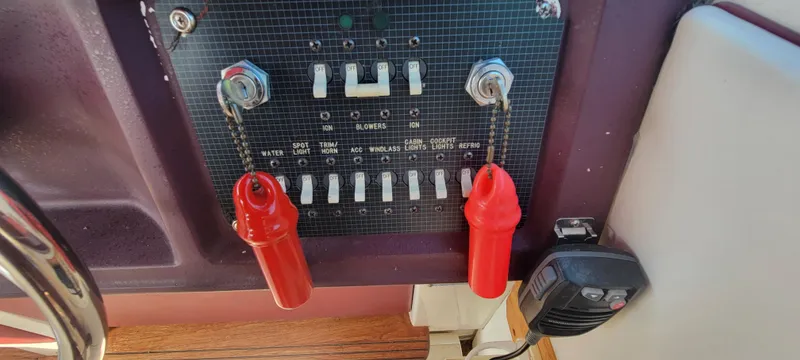 Slide: The Image of Dashboard of a 1988 Sea Ray 340 Express Cruiser with switches. - 47