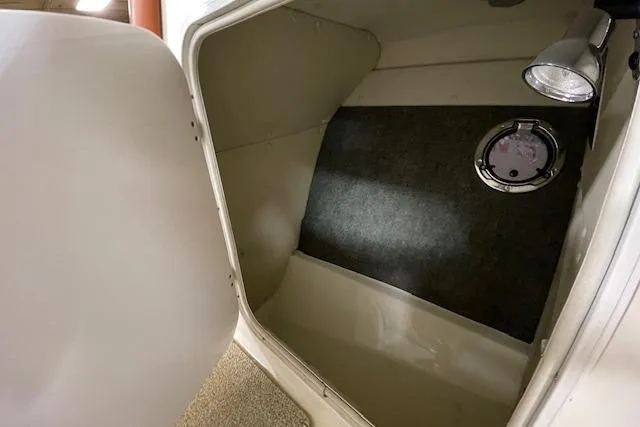 Slide: The Image of Interior cabin of 2006 Doral 265 Elite Bowrider with light and hatch. - 14
