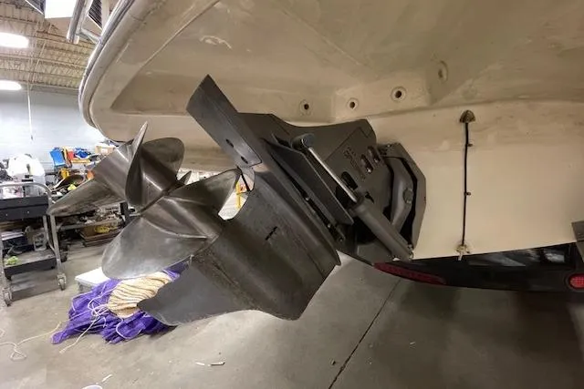 Slide: The Image of 2006 Doral 265 Elite Bowrider boat propeller and stern in a workshop setting. - 5