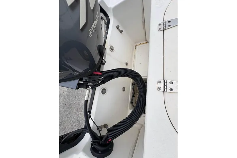 Slide: The Image of 2007 Boston Whaler 150 Montauk boat engine compartment with Yamaha motor detail. - 13