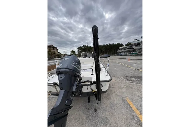 Slide: The Image of 2007 Boston Whaler 150 Montauk with Yamaha engine in a marina parking lot. - 14