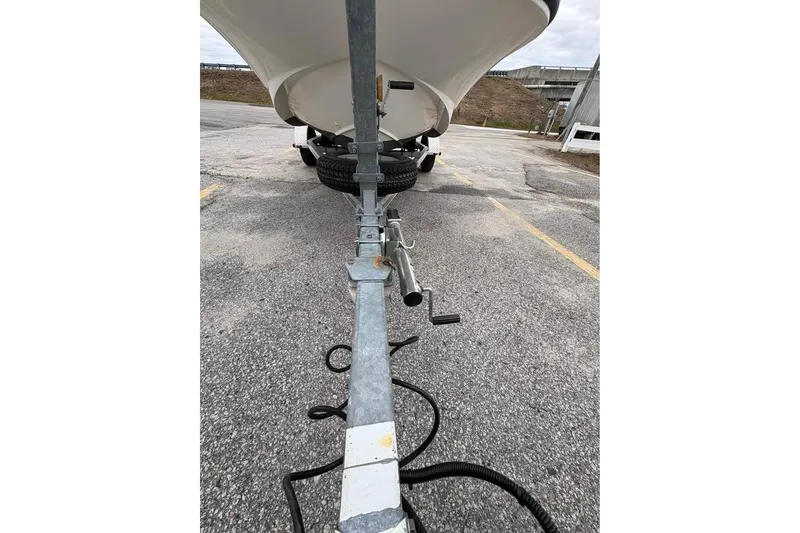 Slide: The Image of 2007 Boston Whaler 150 Montauk on trailer, parked in outdoor lot. - 16