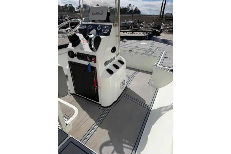 Slide: The Image of 2022 Crestliner 2000 Bay boat interior with Garmin navigation system and modern console design. - 10