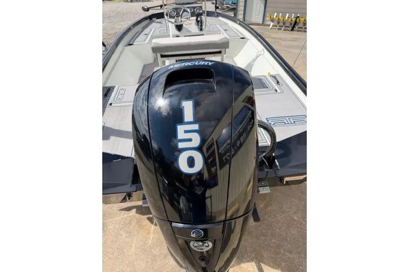 Slide: The Image of 2022 Crestliner 2000 Bay boat with Mercury 150 outboard engine, docked outdoors. - 9