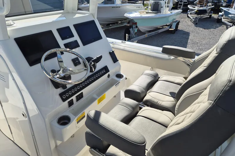 Slide: The Image of 2026 Key West 263 FS boat interior with modern dashboard and comfortable seating. - 6