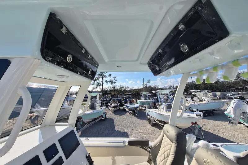 Slide: The Image of Interior view of 2026 Key West 263 FS boat, showcasing helm and seating area. - 8