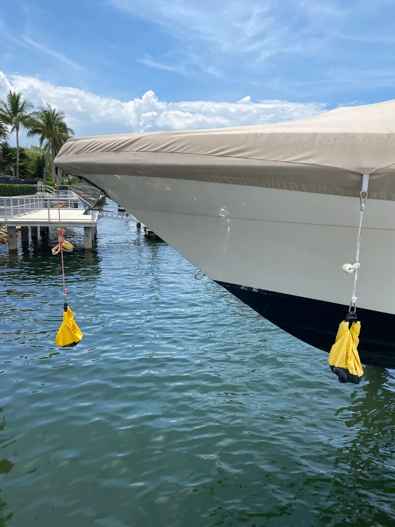 Slide: The Image of Century 3200 boat from 2020 docked with covers. - 2