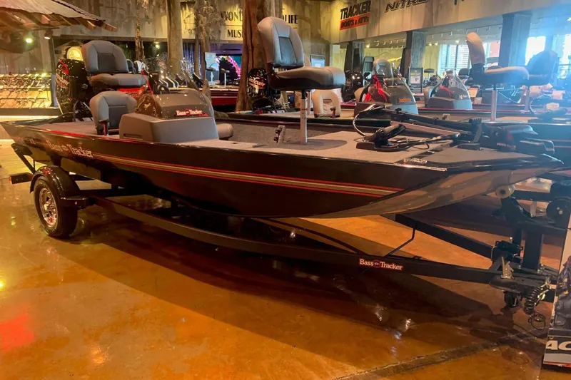 The Image of 2026 Tracker Bass Tracker Classic XL boat displayed in showroom with sleek design and modern features. - 0