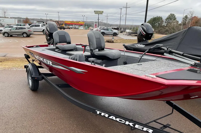The Image of 2025 Tracker Panfish 17 boat in parking lot, red exterior, dual seats, Mercury motor. - 0