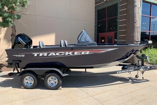 Slide: The Image of 2026 Tracker Pro Guide V-175 WT boat on trailer, parked outdoors. - 9