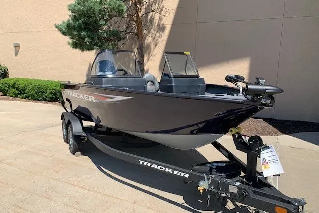 Slide: The Image of 2026 Tracker Pro Guide V-175 WT boat on trailer, parked outdoors. - 13