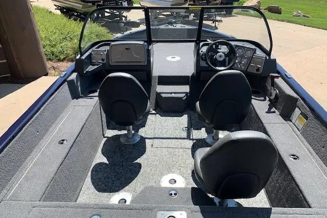 Slide: The Image of 2026 Tracker Pro Guide V-175 WT boat interior with dual seats and steering console. - 11