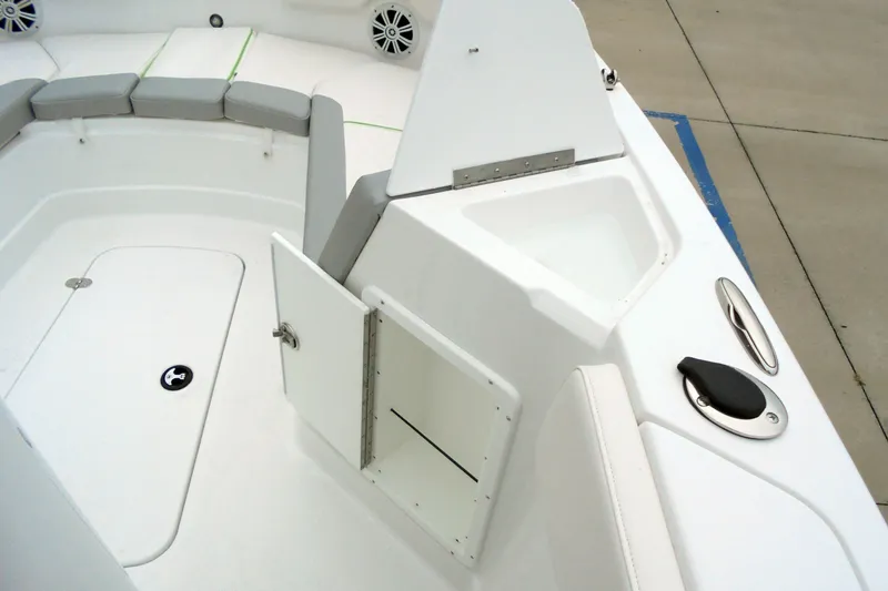Slide: The Image of 2024 Tahoe 2150 CC boat interior with seating and storage compartments. - 34