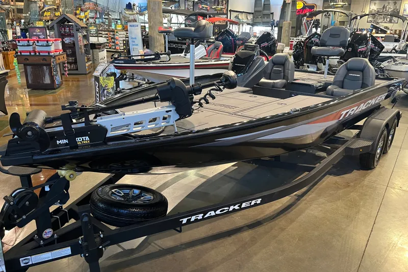 The Image of 2026 Tracker Savage 215 boat displayed in showroom with advanced features. - 0