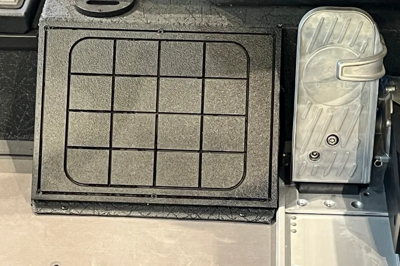Slide: The Image of Pedal assembly of 2026 Tracker Savage 215, featuring textured surfaces and grid pattern. - 18