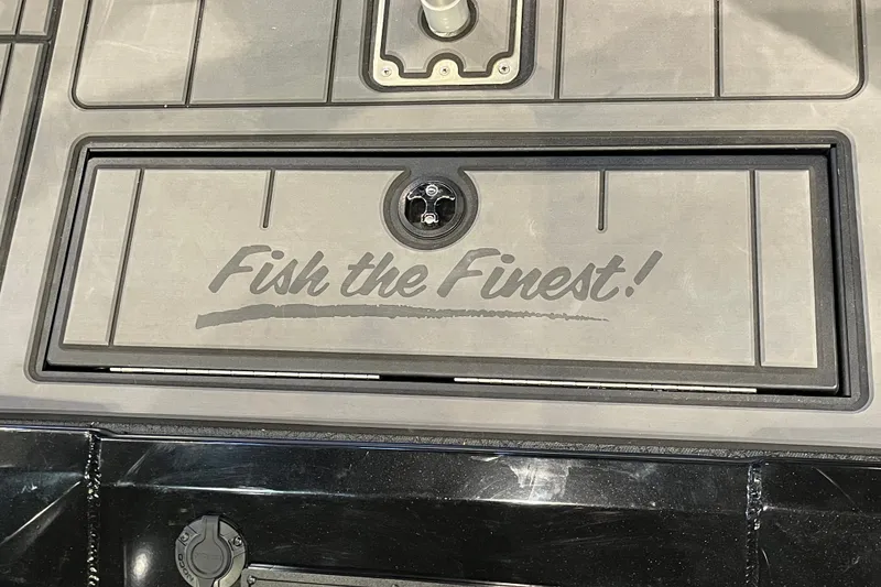 Slide: The Image of 2026 Tracker Savage 215 boat deck with "Fish the Finest!" inscription. - 16